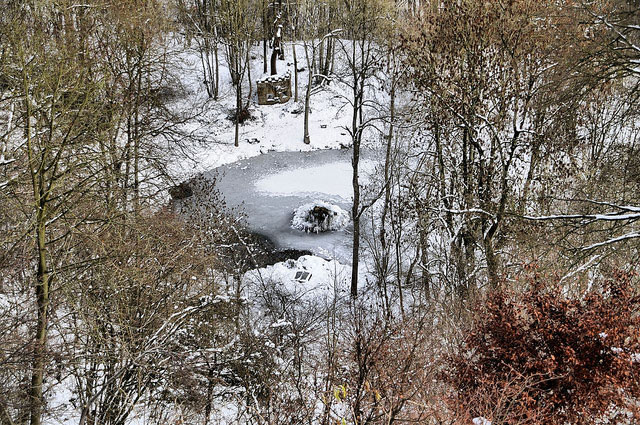 Fountain pond and rustic temple